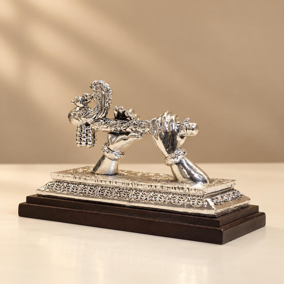 Silver Plated Krishna Hand & Flute Figurine, Peacock Motif, Wooden Base (5x7.5")